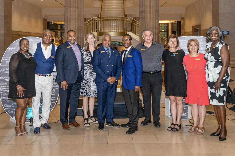Big group photos in front of the HOPE sign